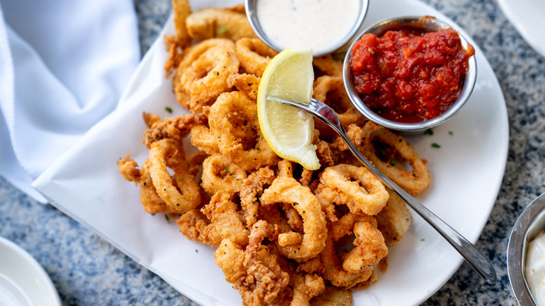 fried calamari with lemon and tomato sauce