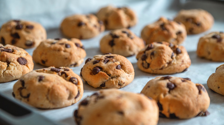 Chocolate chip cookies on parchment-lined baking sheet