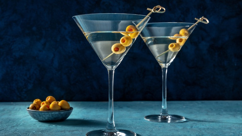 martinis with olive garnishes