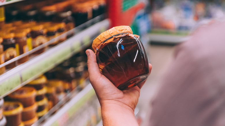 shopping for honey in the grocery store