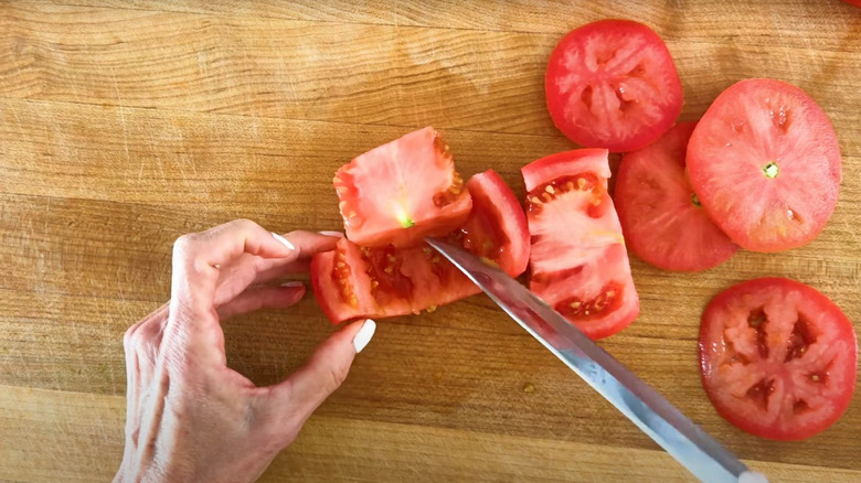 Cutting out tomato seeds and pulp