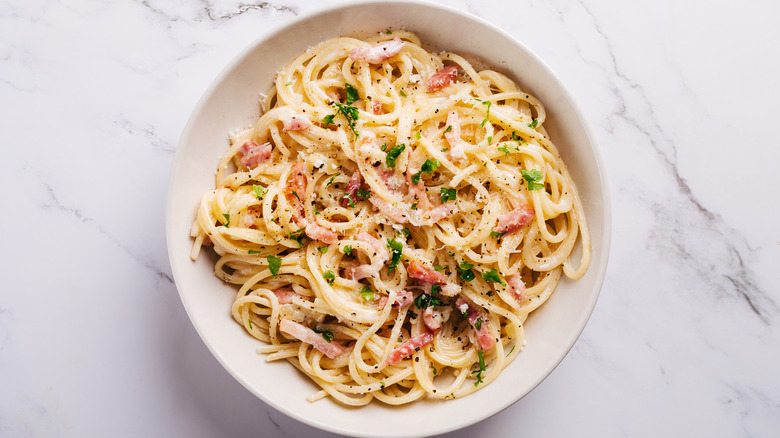 Carbonara pasta in a white bowl