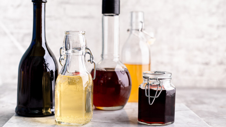 Vinegars in glass bottles on countertop