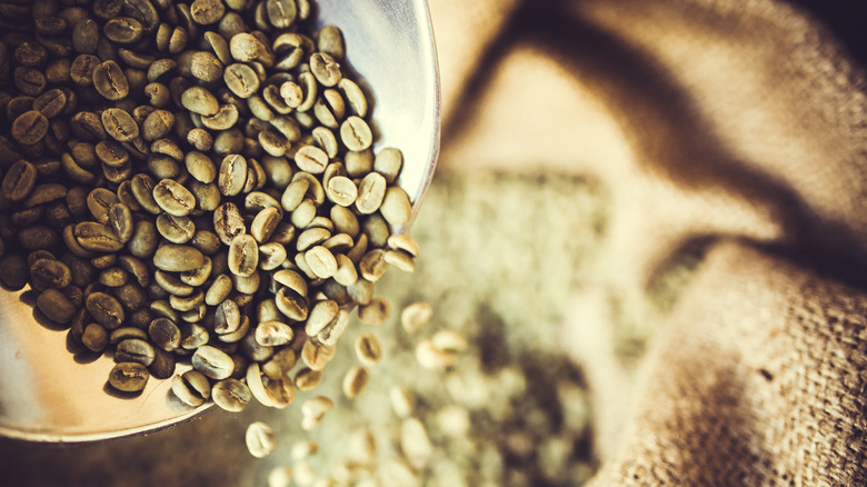 Raw coffee beans with burlap bag