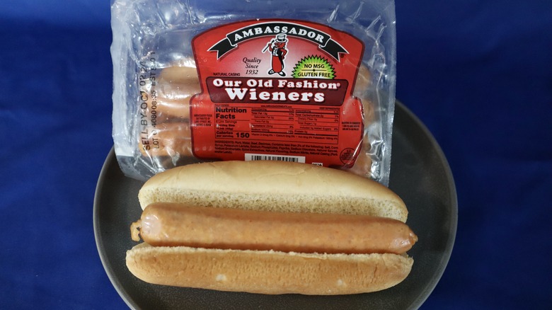 hot dog on plate in bun with package