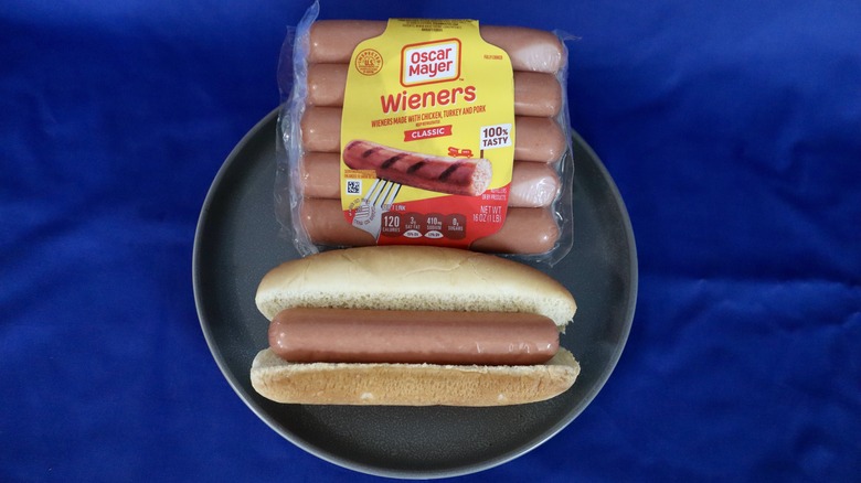 hot dog on plate next to package