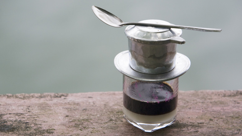 A traditional Vietnamese coffee with, with a filter on top