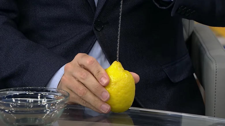 Juicing lemon with a skewer