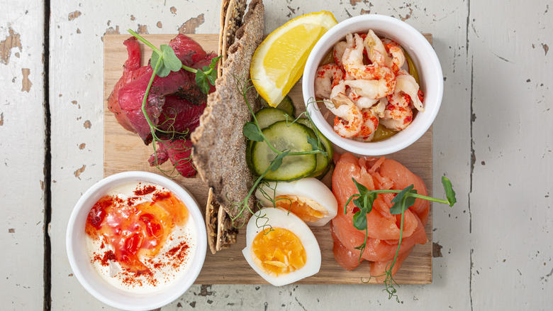 Classic smörgåsbord with smoked fish, pickles, and eggs