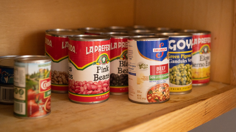 Canned food on shelves in pantry