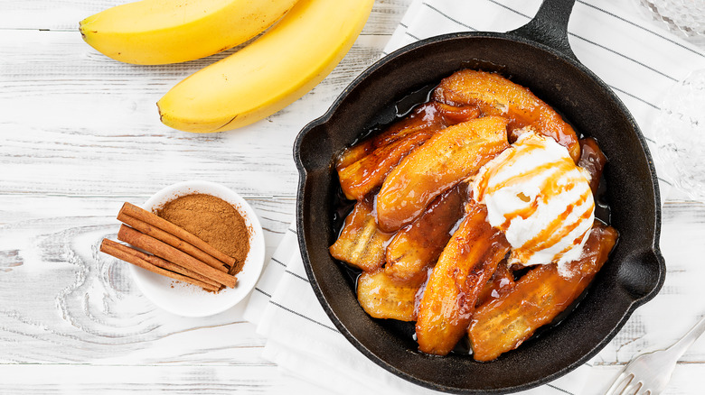 Cast iron pan with bananas foster and ice cream