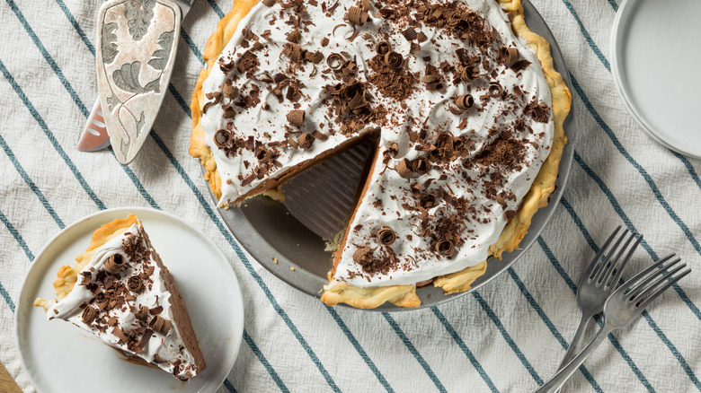 An entire French silk pie with an individual slice on a plate