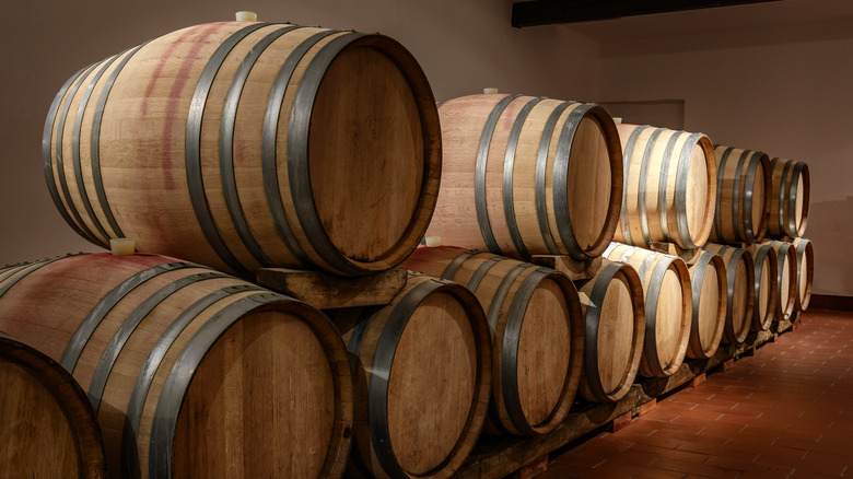 bourbon barrels stacked in two horizontal rows