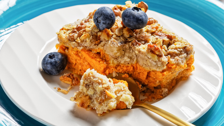 pumpkin dump cake slice with blueberries