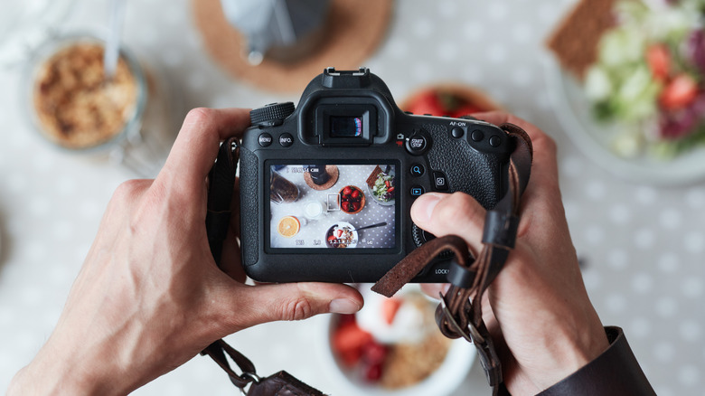 food stylist camera taking photo of food