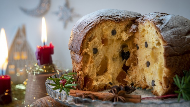 A loaf of panettone with a slice cut out of it