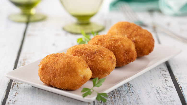 Homemade deep-fried croquetas on a plate