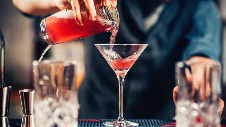 Bartender making a Cosmopolitan cocktail