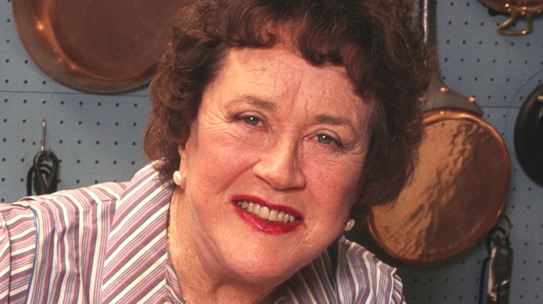 Julia Child smiling in her kitchen