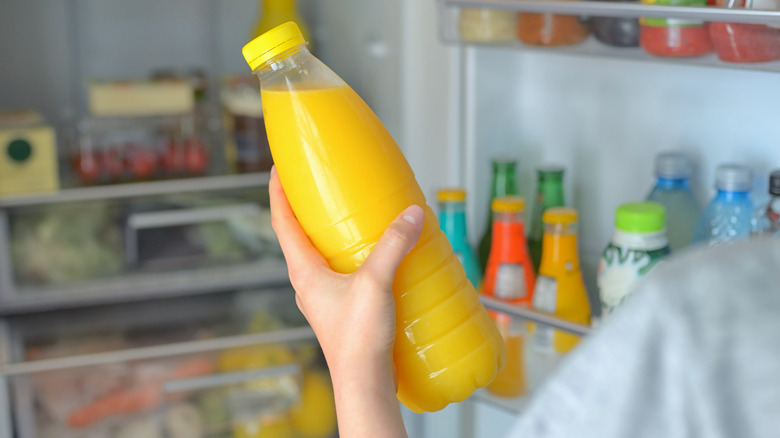 holding orange juice outside refrigerator