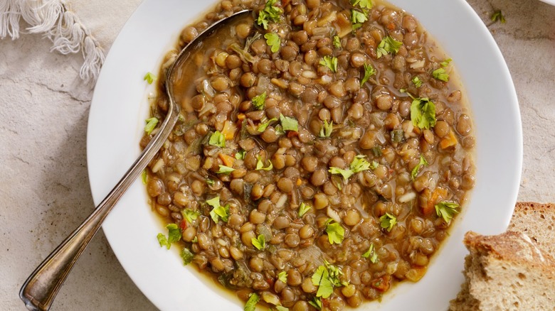 lentils in a bowl served with bread