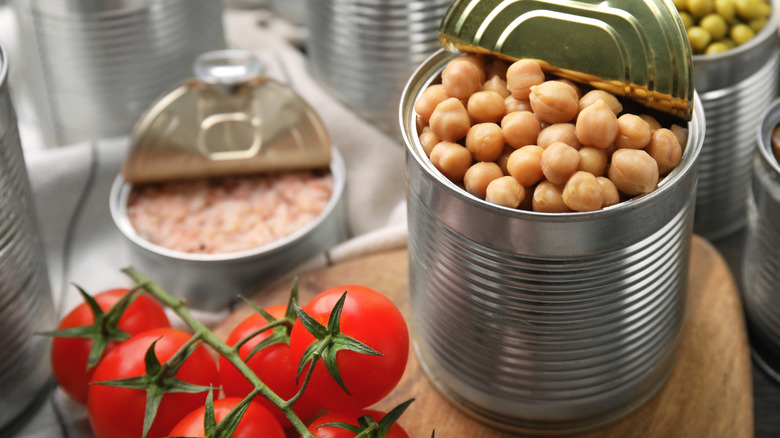 Open tin can of chickpeas and various other ingredients