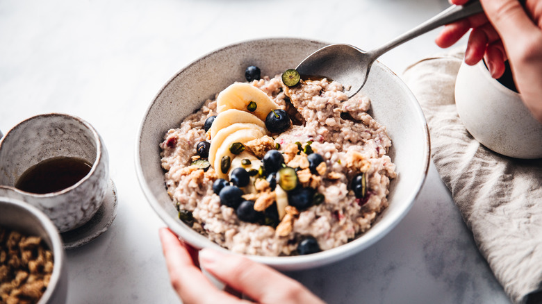 A bowl of oats with fruits