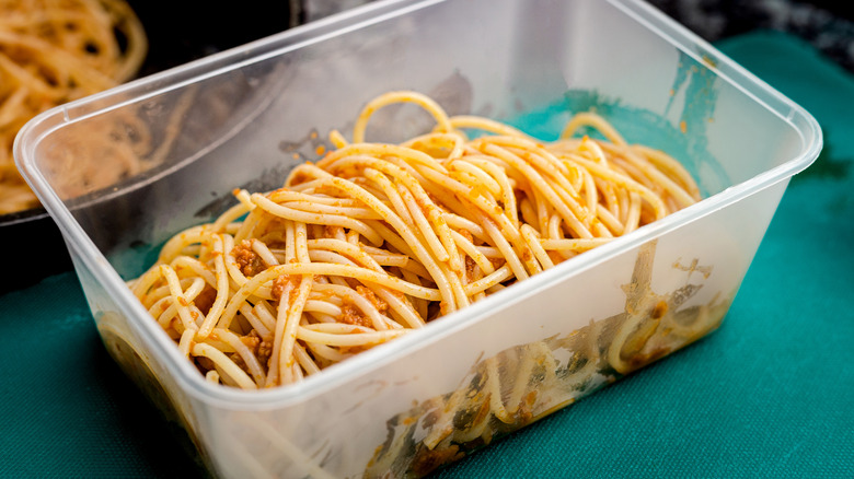 Plastic container of spaghetti noodles