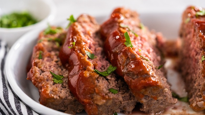 Close up of meatloaf slices with tomato glaze