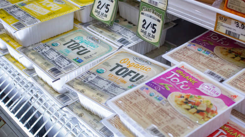 tofu varieties in a grocery store case