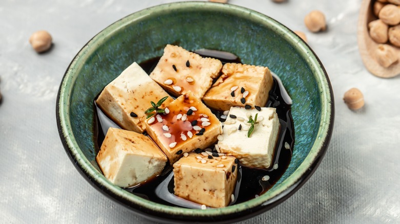 a bowl of tofu in marinade