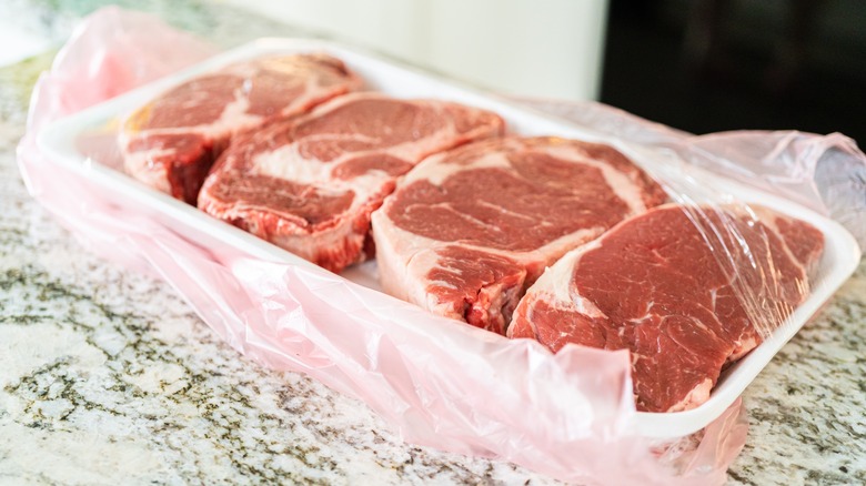 Raw ribeye steaks in store packaging