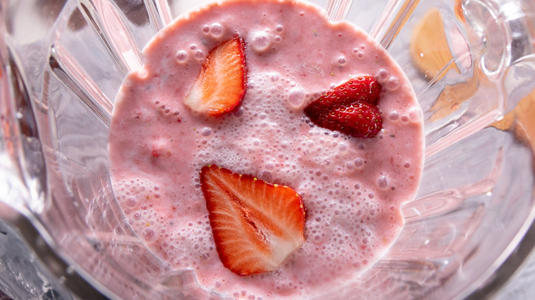 Strawberry smoothie in a blender