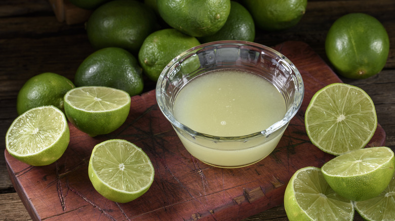 Bowl of lime juice and fresh limes