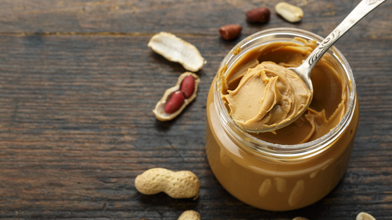 jar of peanut butter with spoon inside