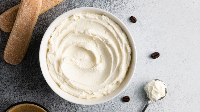 Ricotta in bowl next to ladyfingers