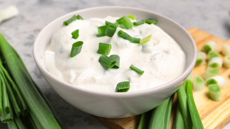 bowl of sour cream with scallions