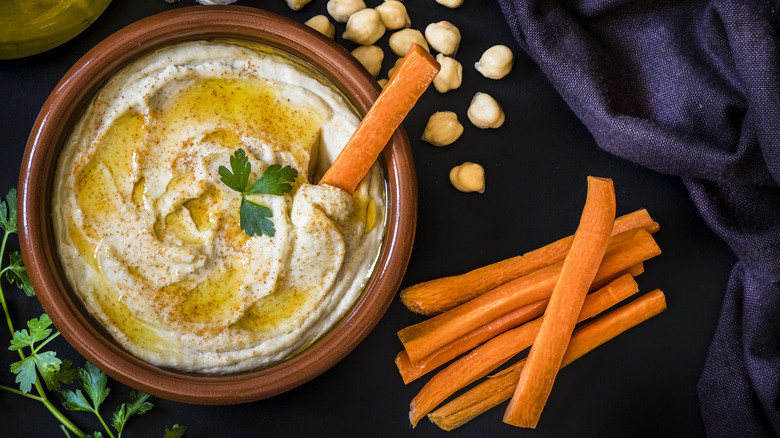hummus served with carrot sticks