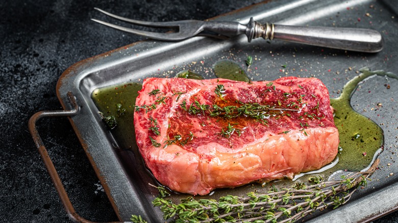 Marinated raw steak with herbs