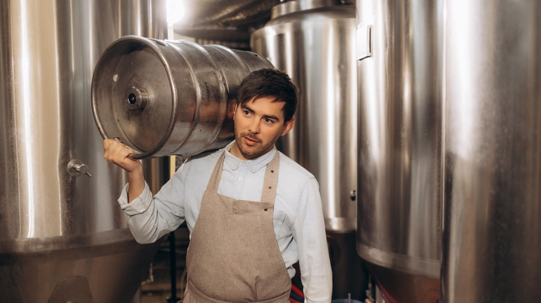 Brewer with full-sized keg