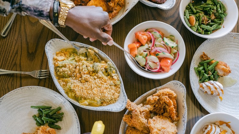 Dishes of Southern food on wood table