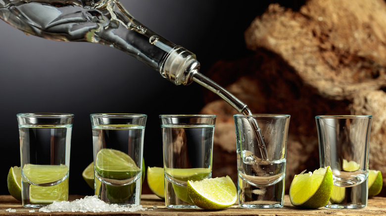 Tequila poured into shot glasses