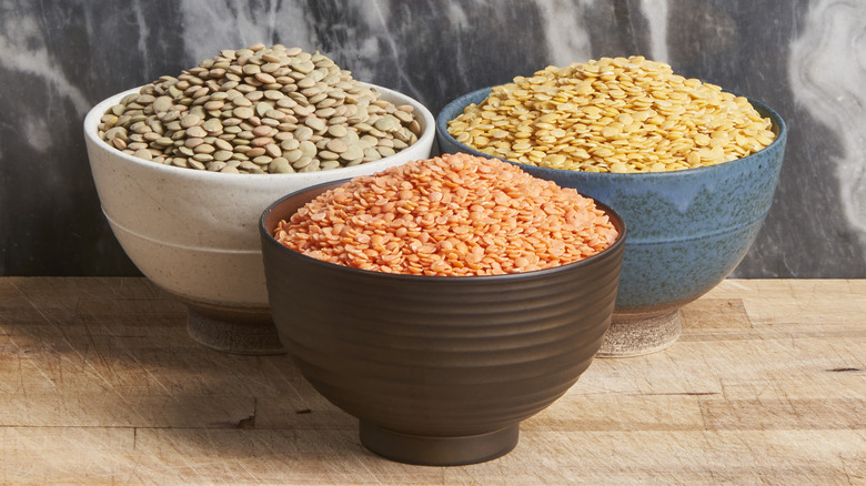 Bowls of different types of dried lentils