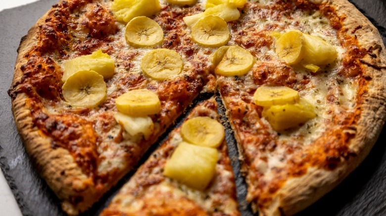 Swedish pizza topped with banana and pineapple