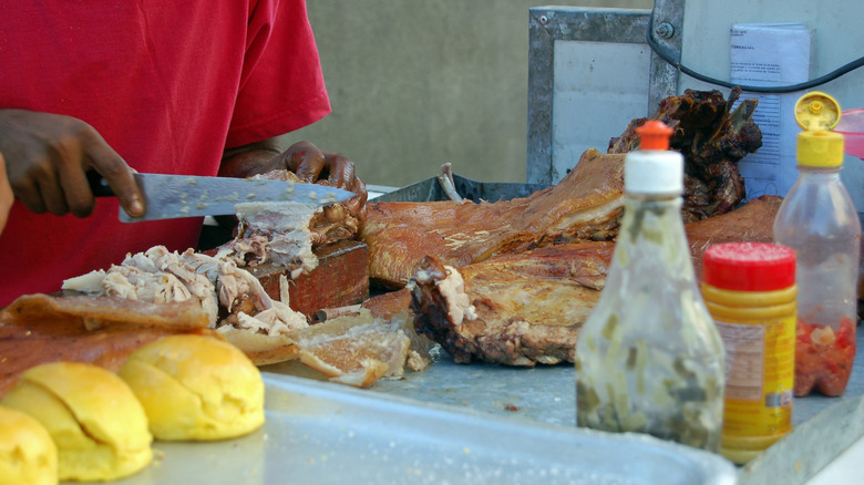 Cutting pork for a Cuban sandwich