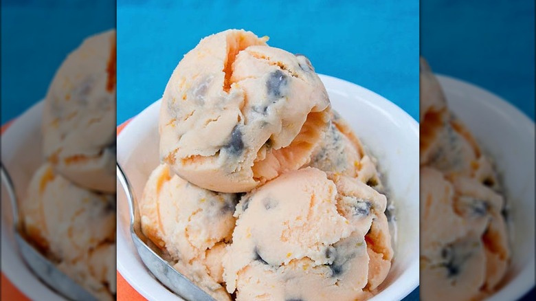 scoops of tiger tail ice cream in a white bowl