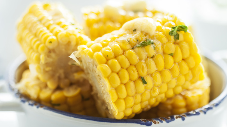 plate of corn on the cob with butter