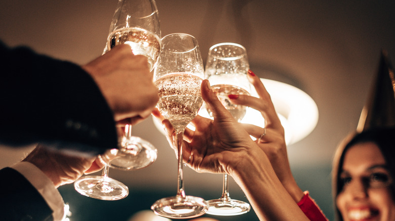 people toasting with sparkling wine