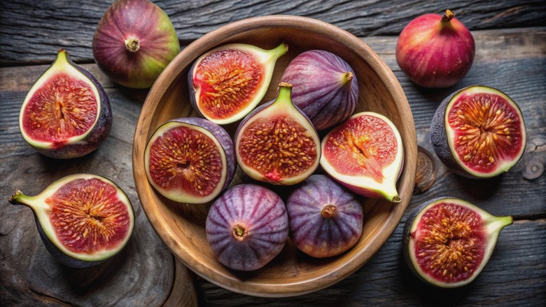 Fresh figs in wooden bowl