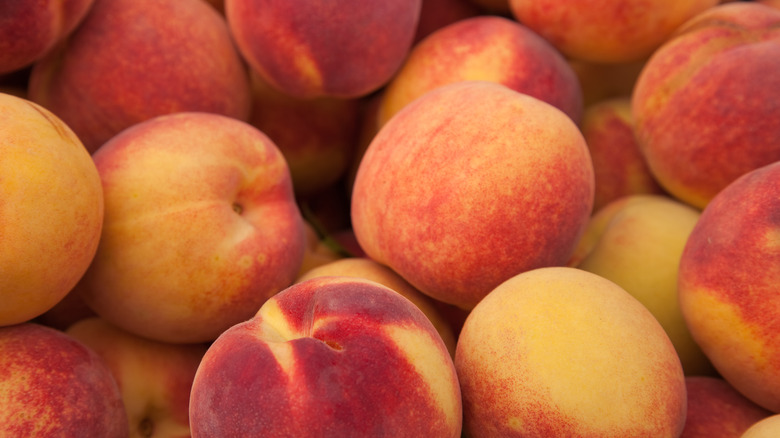 A bunch of stacked peaches